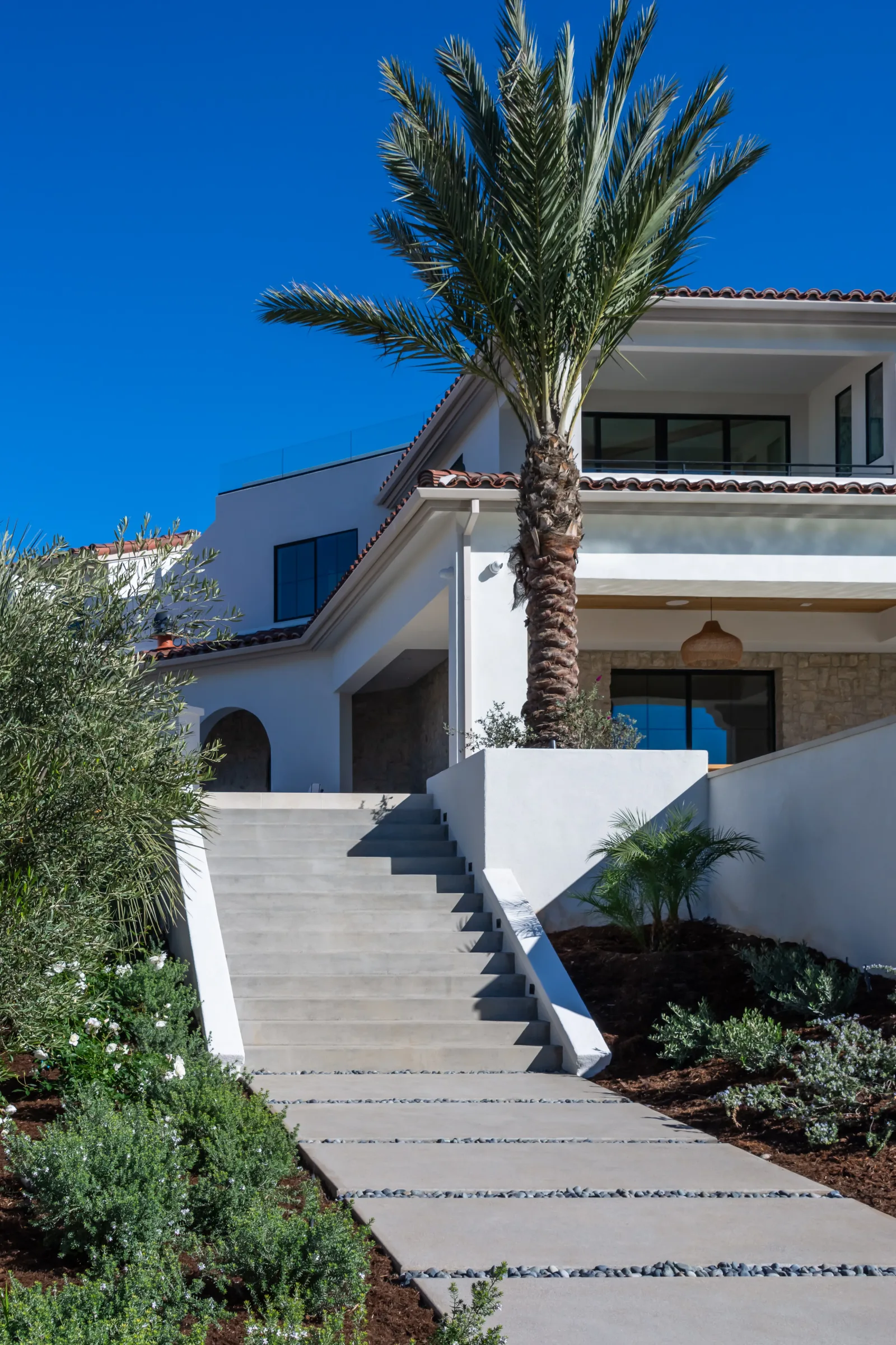 Full backyard remodel in El Cajon CA with paver patio, outdoor kitchen, and shaded cover