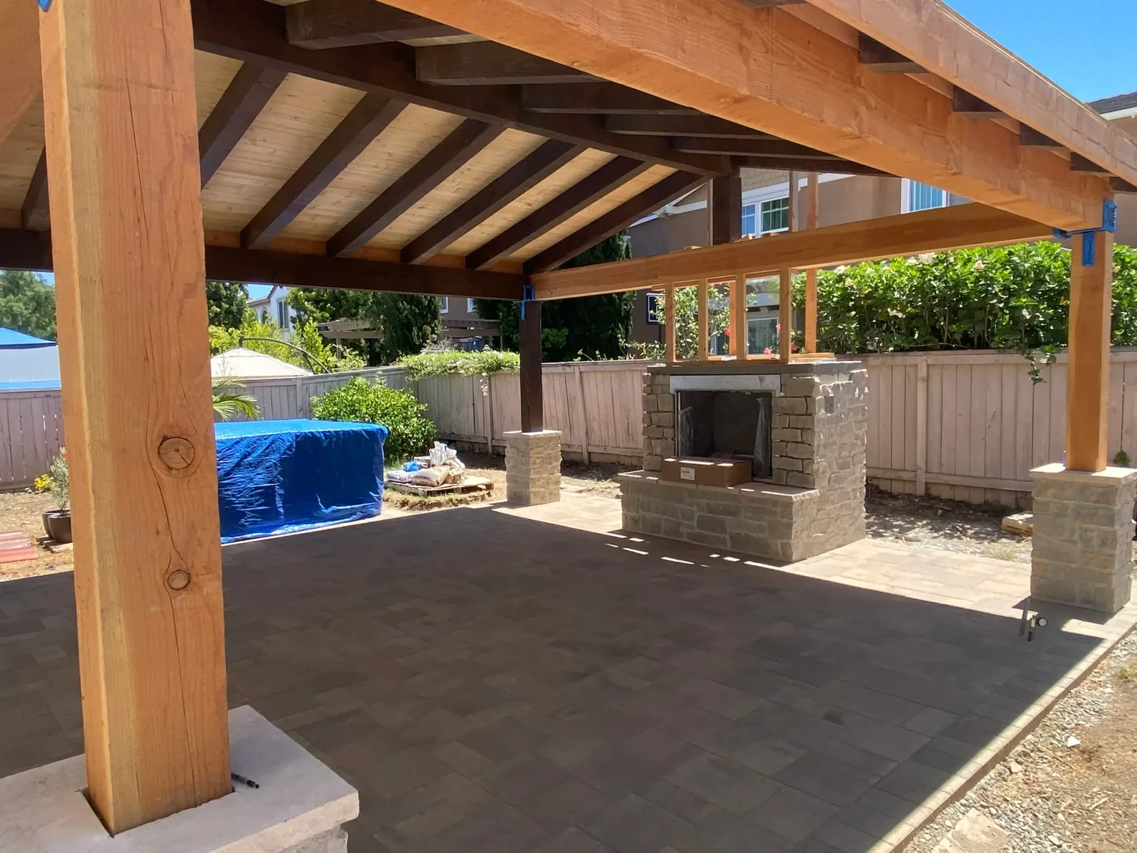 Coastal-modern backyard with paver patio and outdoor living space in Encinitas CA