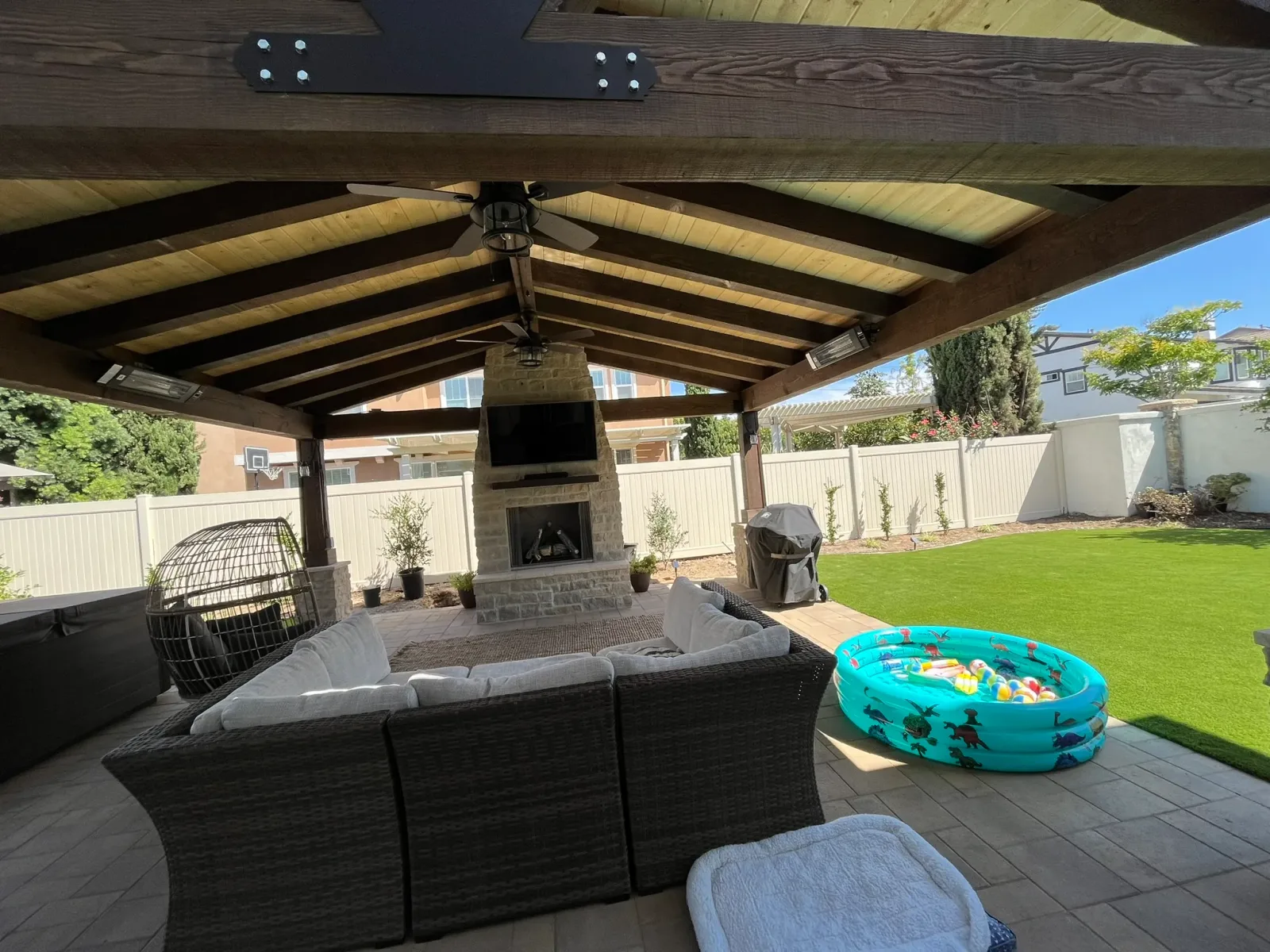 Luxury backyard at golden hour with warm ambient lighting
